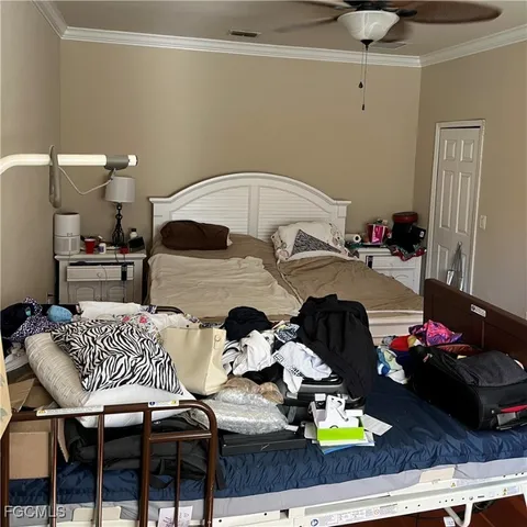 a bedroom with furniture and a chandelier