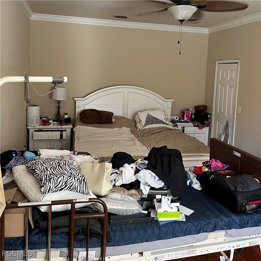 2702 Nature Pointe Loop Fort Myers, FL 33905 - Photo 15 of 25 a bedroom with furniture and a chandelier