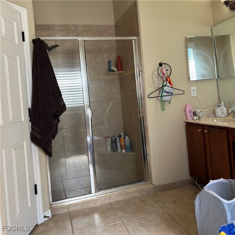 2702 Nature Pointe Loop Fort Myers, FL 33905 - Photo 19 of 25 a bathroom with a sink and mirror