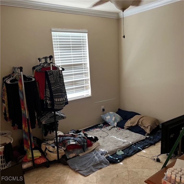 2702 Nature Pointe Loop Fort Myers, FL 33905 - Photo 22 of 25 a bedroom with a bed and a window