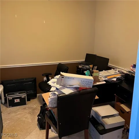 a room with furniture and a floor to ceiling window