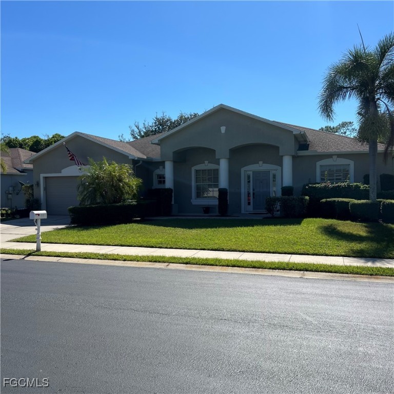 2702 Nature Pointe Loop Fort Myers, FL 33905 - Photo 3 of 25 a view of a house with a swimming pool and a yard