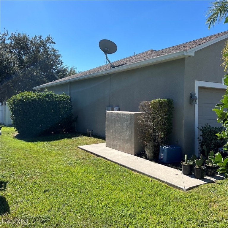 2702 Nature Pointe Loop Fort Myers, FL 33905 - Photo 5 of 25 a backyard of a house with lots of green space