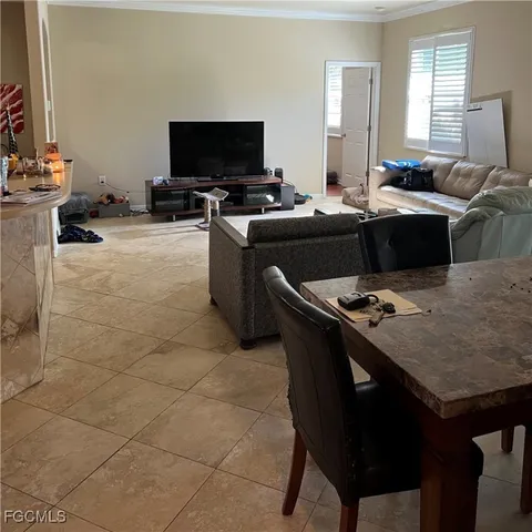 a kitchen with a sink a stove a table and chairs