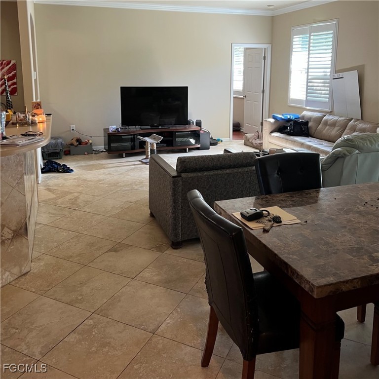 2702 Nature Pointe Loop Fort Myers, FL 33905 - Photo 10 of 25 a kitchen with a sink a stove a table and chairs