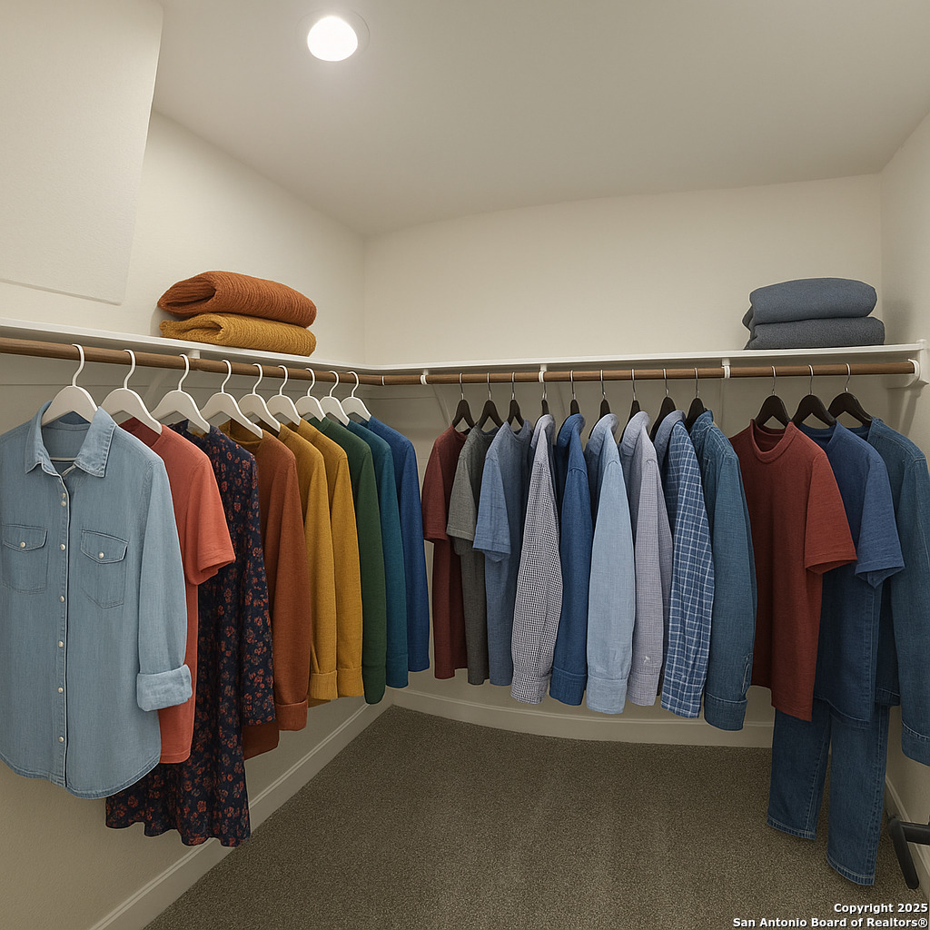 660 Cypress Pass Road Spring Branch, TX 78070 - Photo 12 of 21 a view of walk in closet with clothes and shoes