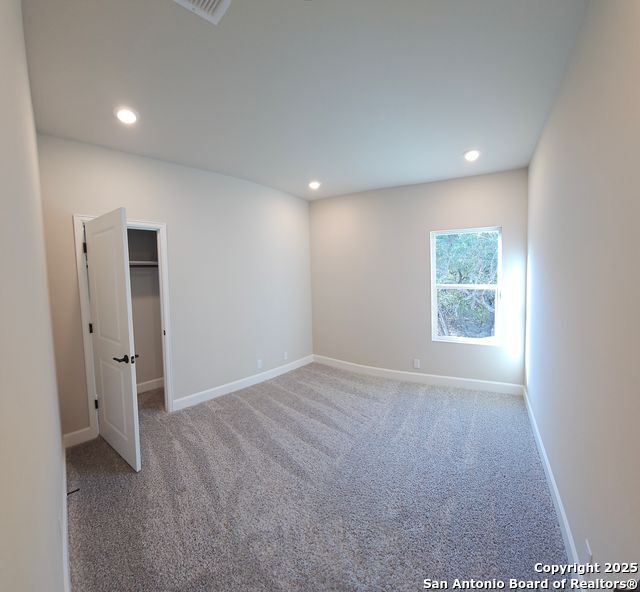 660 Cypress Pass Road Spring Branch, TX 78070 - Photo 14 of 21 a view of an empty room with a window