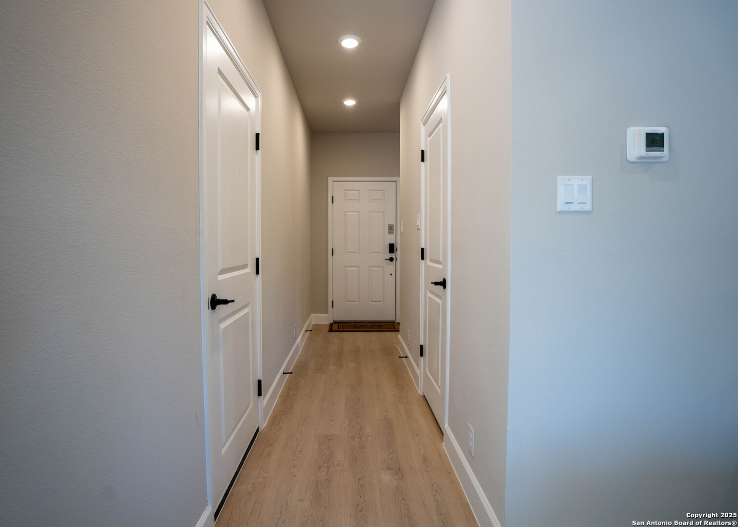 660 Cypress Pass Road Spring Branch, TX 78070 - Photo 3 of 21 a view of a hallway with wooden floor