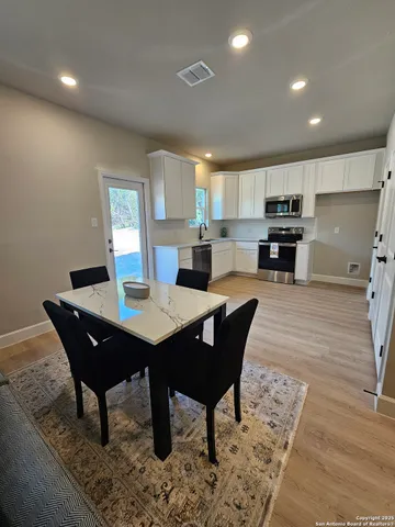 a view of a dining room with furniture