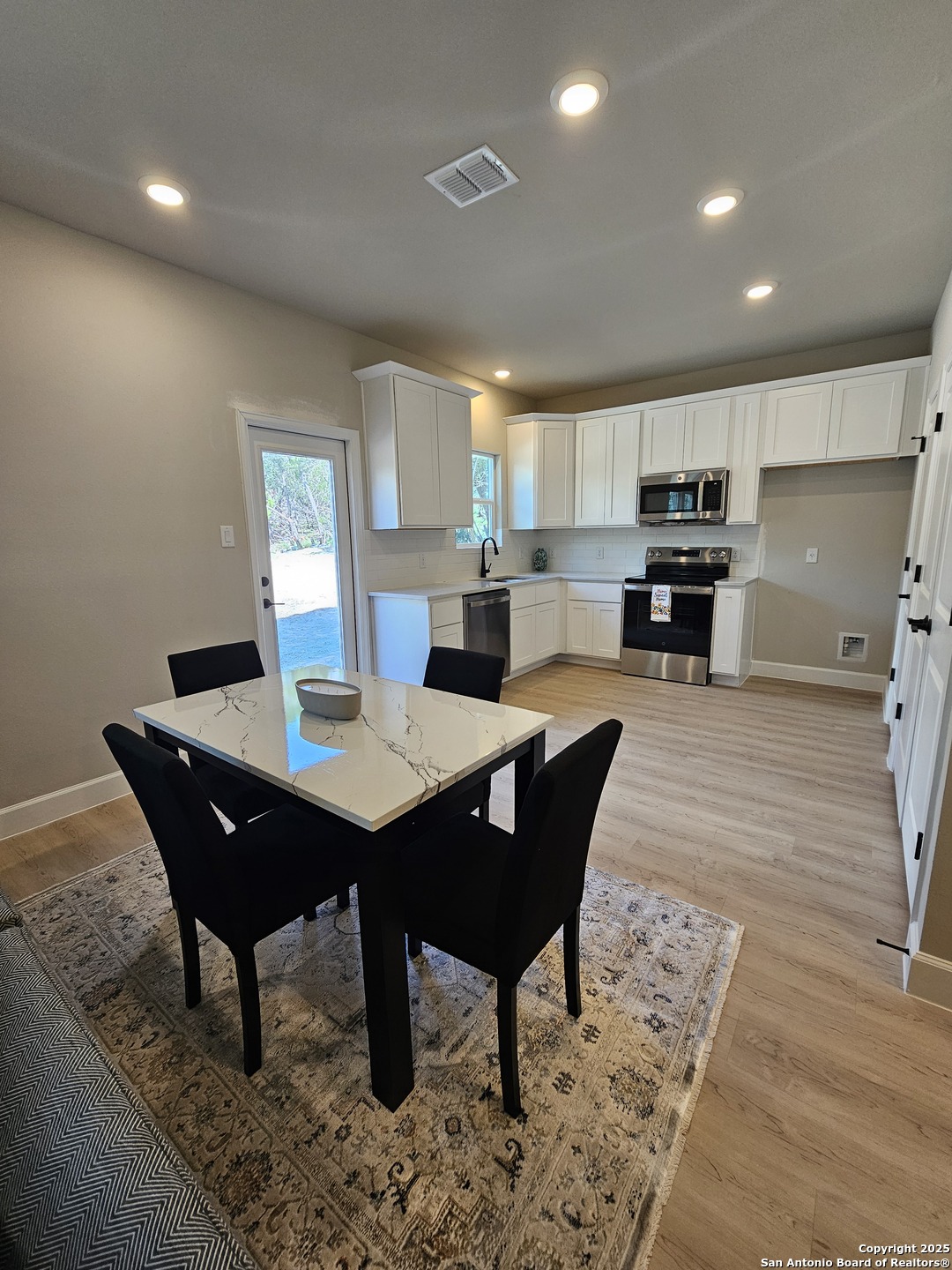 660 Cypress Pass Road Spring Branch, TX 78070 - Photo 5 of 21 a view of a dining room with furniture