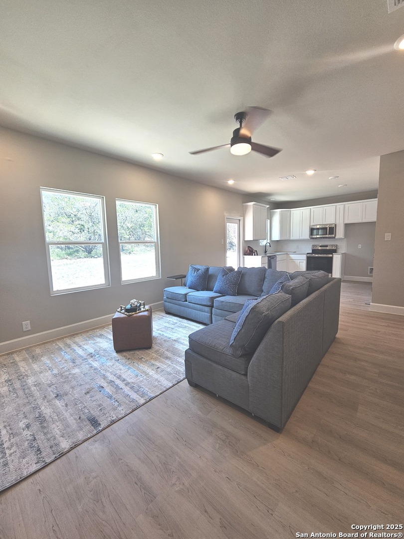 660 Cypress Pass Road Spring Branch, TX 78070 - Photo 8 of 21 a living room with furniture window and wooden floor