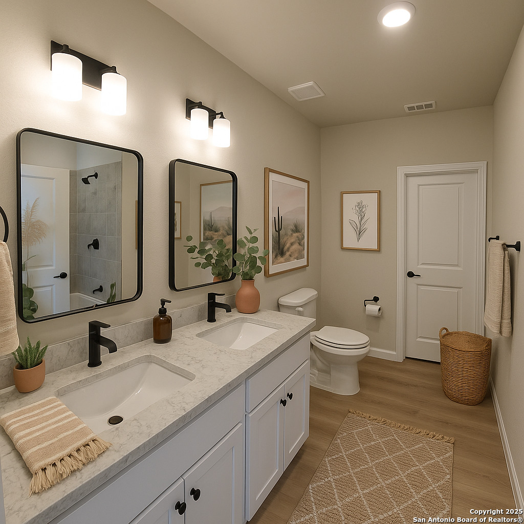 660 Cypress Pass Road Spring Branch, TX 78070 - Photo 9 of 21 a bathroom with a toilet a sink and mirror