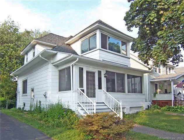 front view of a house with a yard
