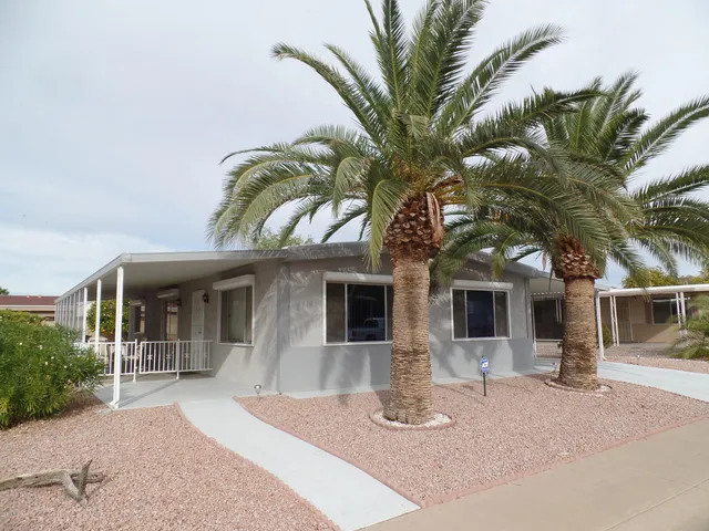 a view of a house with a tree