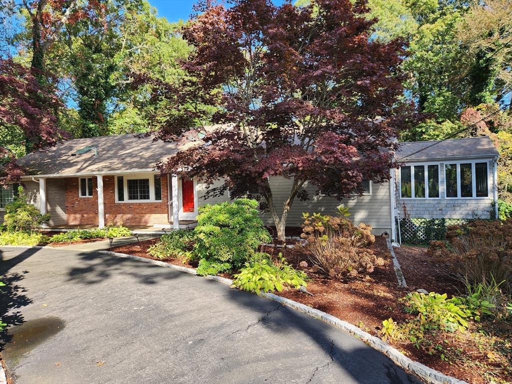 front view of a house with a small yard