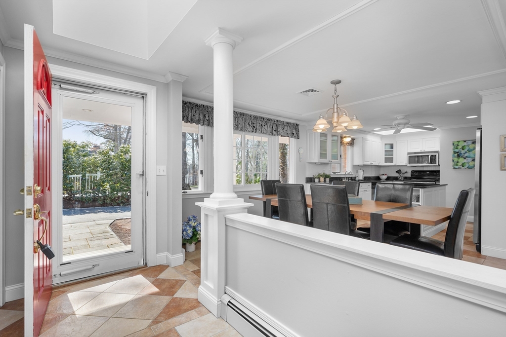 91 Holly Point Road Barnstable, MA 02632 - Photo 11 of 42 a room with stainless steel appliances kitchen island granite countertop a refrigerator and a sink