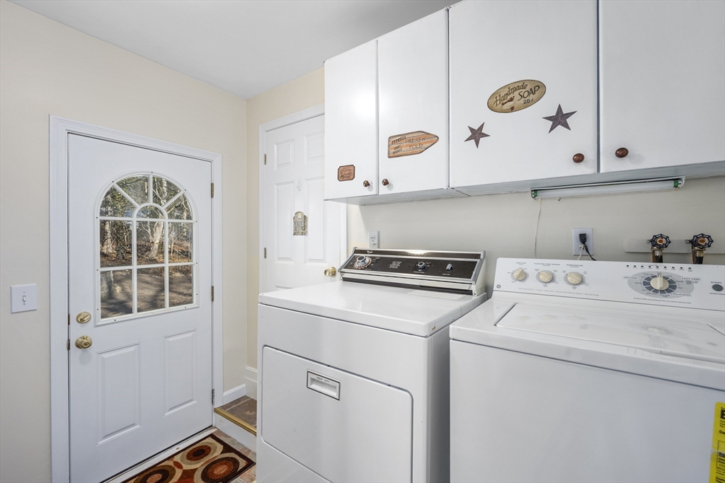 91 Holly Point Road Barnstable, MA 02632 - Photo 16 of 42 a utility room with dryer and washer