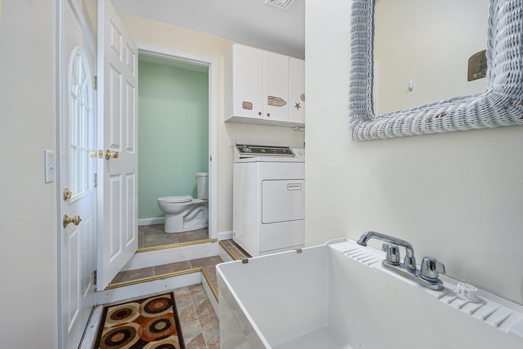 91 Holly Point Road Barnstable, MA 02632 - Photo 17 of 42 a bathroom with a sink a toilet and shower