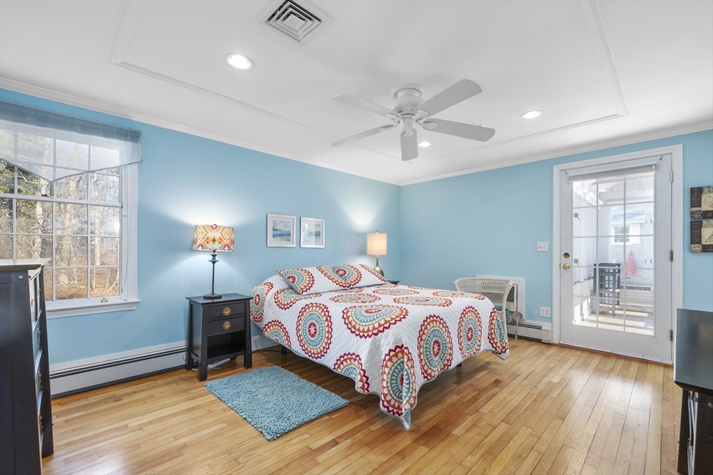 91 Holly Point Road Barnstable, MA 02632 - Photo 18 of 42 a bedroom with a large bed and a window