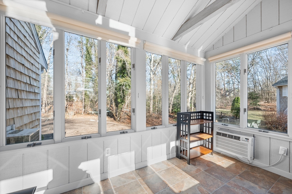 91 Holly Point Road Barnstable, MA 02632 - Photo 23 of 42 a living room filled with furniture and a large window
