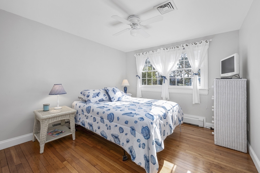 91 Holly Point Road Barnstable, MA 02632 - Photo 25 of 42 a bedroom with a bed and a window
