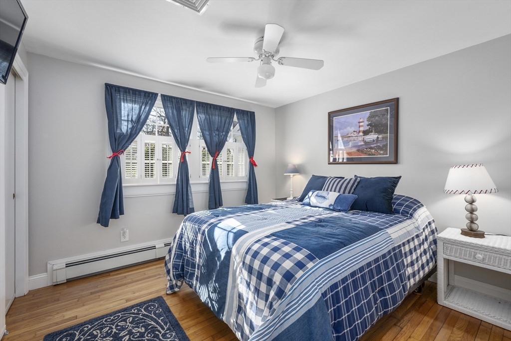 91 Holly Point Road Barnstable, MA 02632 - Photo 27 of 42 a bedroom with bed and a window