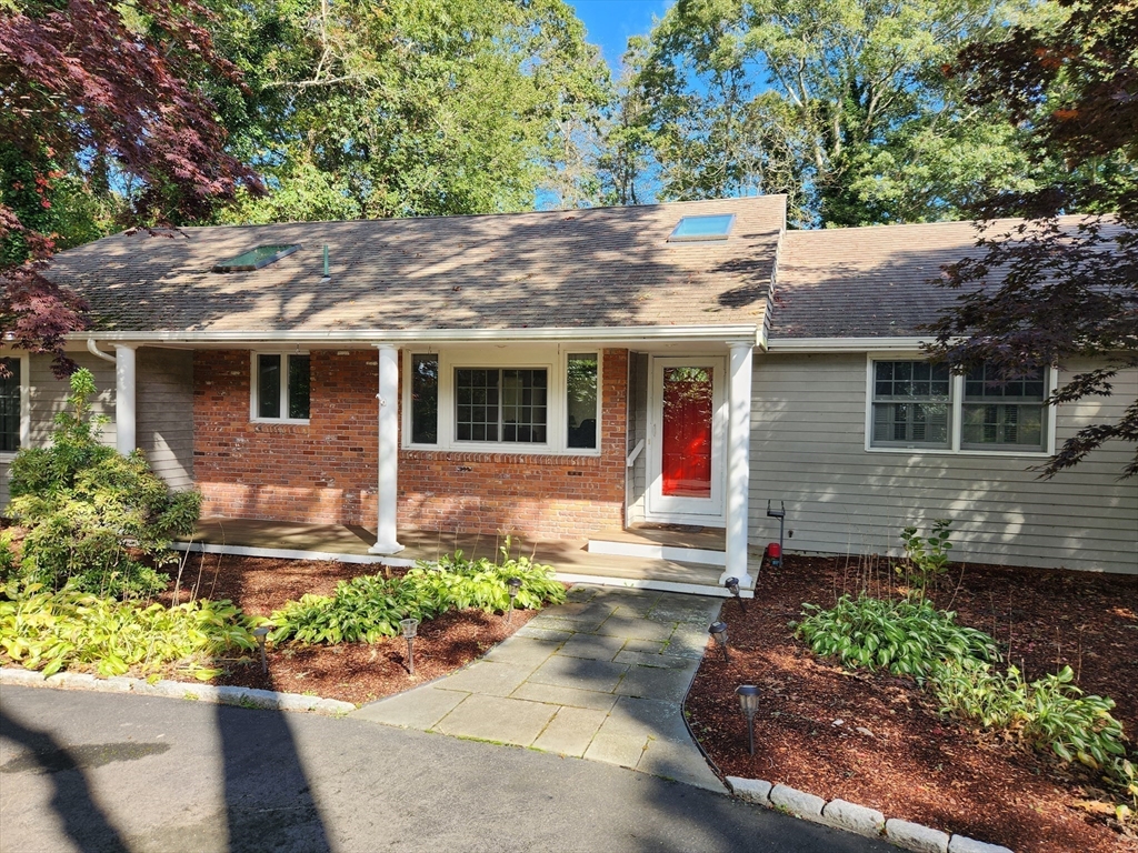 91 Holly Point Road Barnstable, MA 02632 - Photo 35 of 42 a front view of a house with a yard