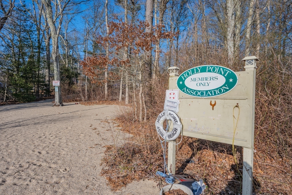 91 Holly Point Road Barnstable, MA 02632 - Photo 37 of 42 a view of a wooden door in front of a house
