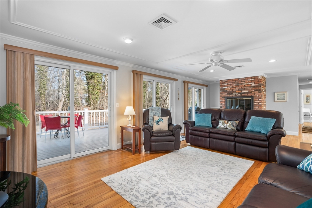 91 Holly Point Road Barnstable, MA 02632 - Photo 6 of 42 a living room with furniture and a large window
