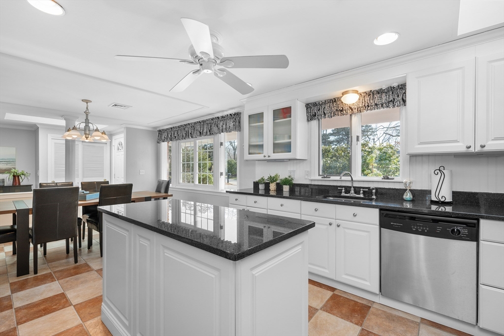 91 Holly Point Road Barnstable, MA 02632 - Photo 8 of 42 a kitchen with granite countertop a sink and cabinets