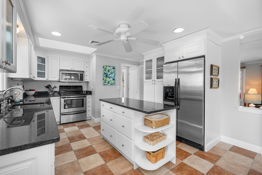 91 Holly Point Road Barnstable, MA 02632 - Photo 9 of 42 a kitchen with granite countertop a refrigerator oven a sink and dishwasher