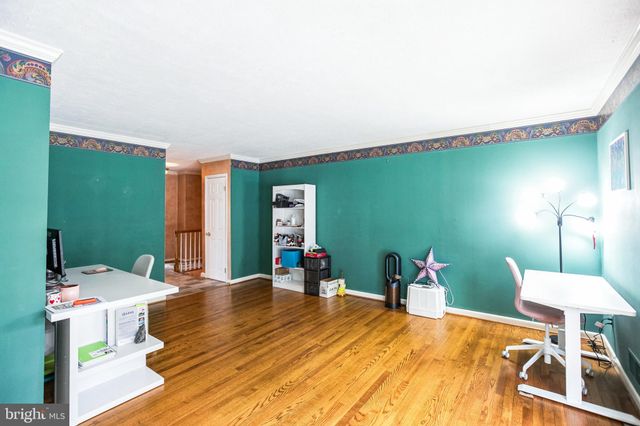 a bedroom with a bed and large mirror