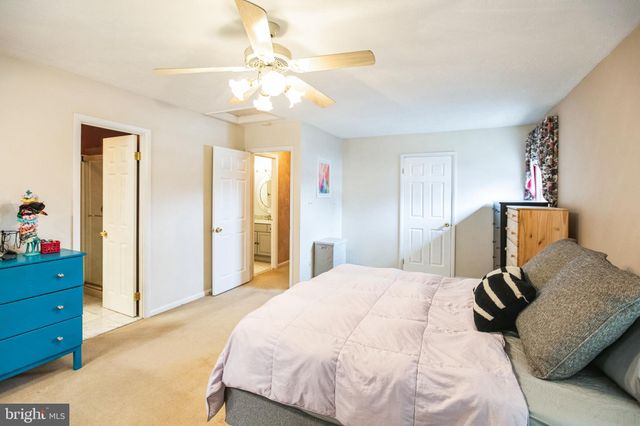 a bedroom with a bed and closet