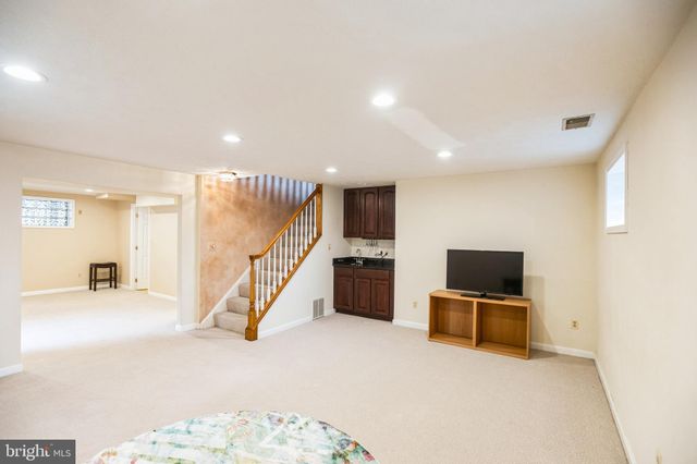 a view of a livingroom with furniture and stairs