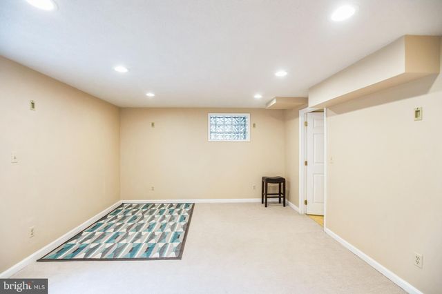 a view of room with furniture and a window