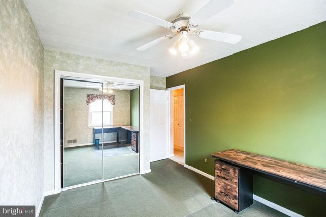 a room with a bed and a chandelier