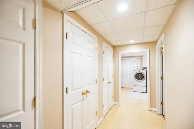 a bathroom with a glass door shower and a sink
