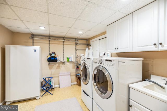 a view of a storage & utility room with washer and dryer