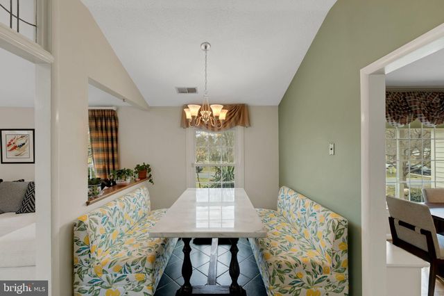 a view of a livingroom with furniture window and wooden floor