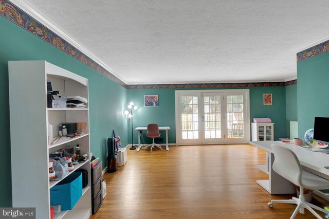 a living room with furniture window and wooden floor