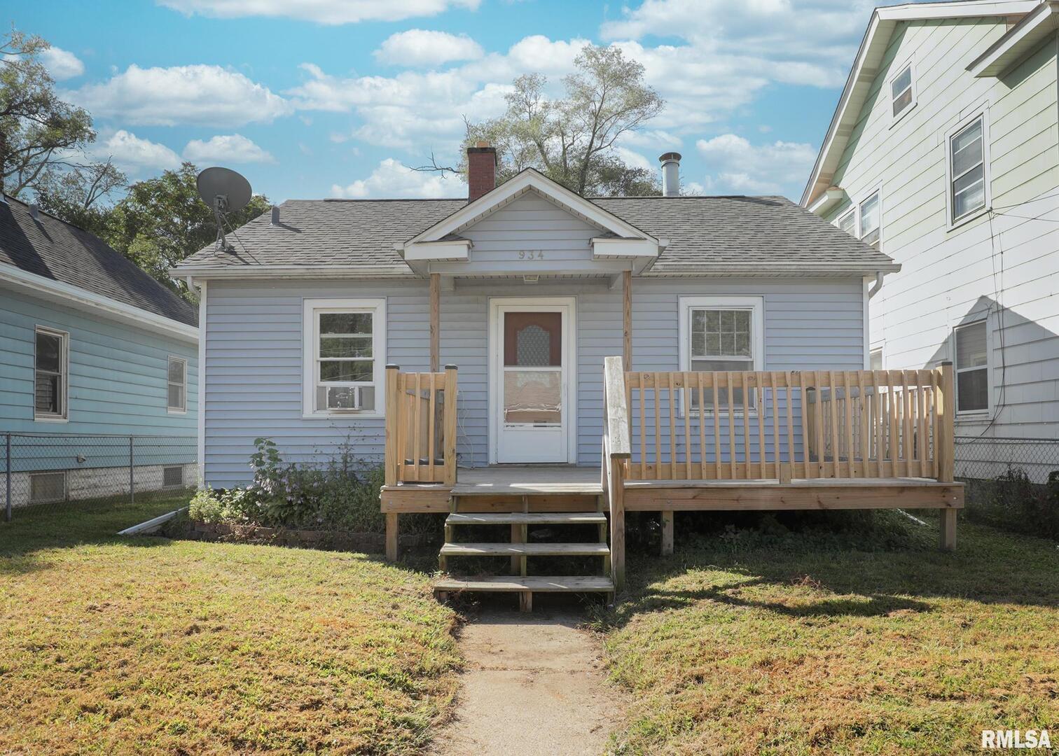 934 20th Avenue Rock Island, IL 61201 - Photo 1 of 26 a view of a house with a yard