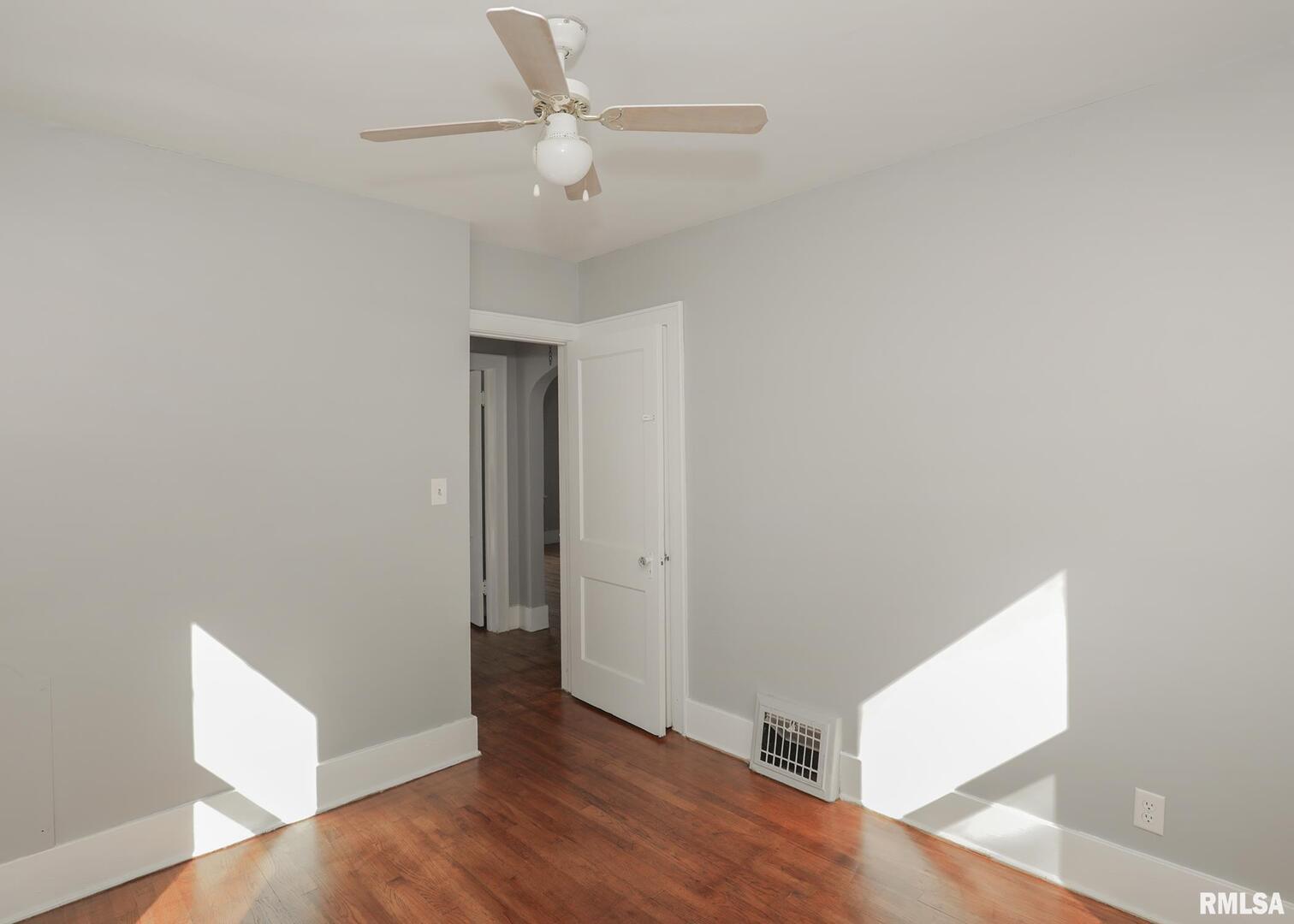 934 20th Avenue Rock Island, IL 61201 - Photo 13 of 26 a view of an empty room with wooden floor