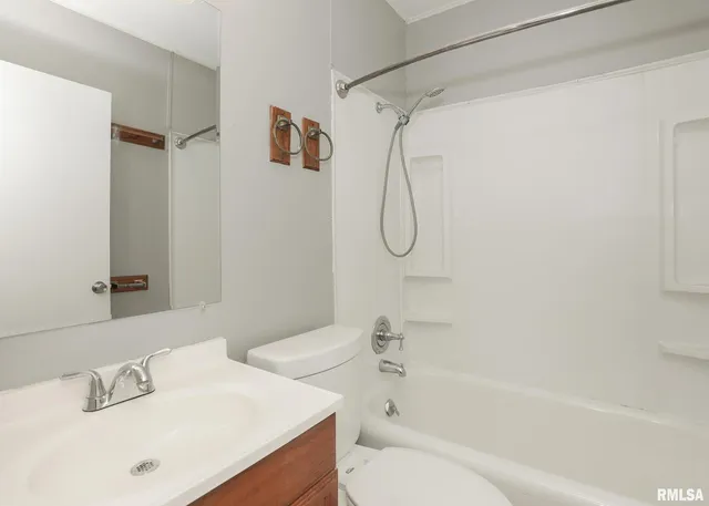 a bathroom with a sink a toilet and a bathtub