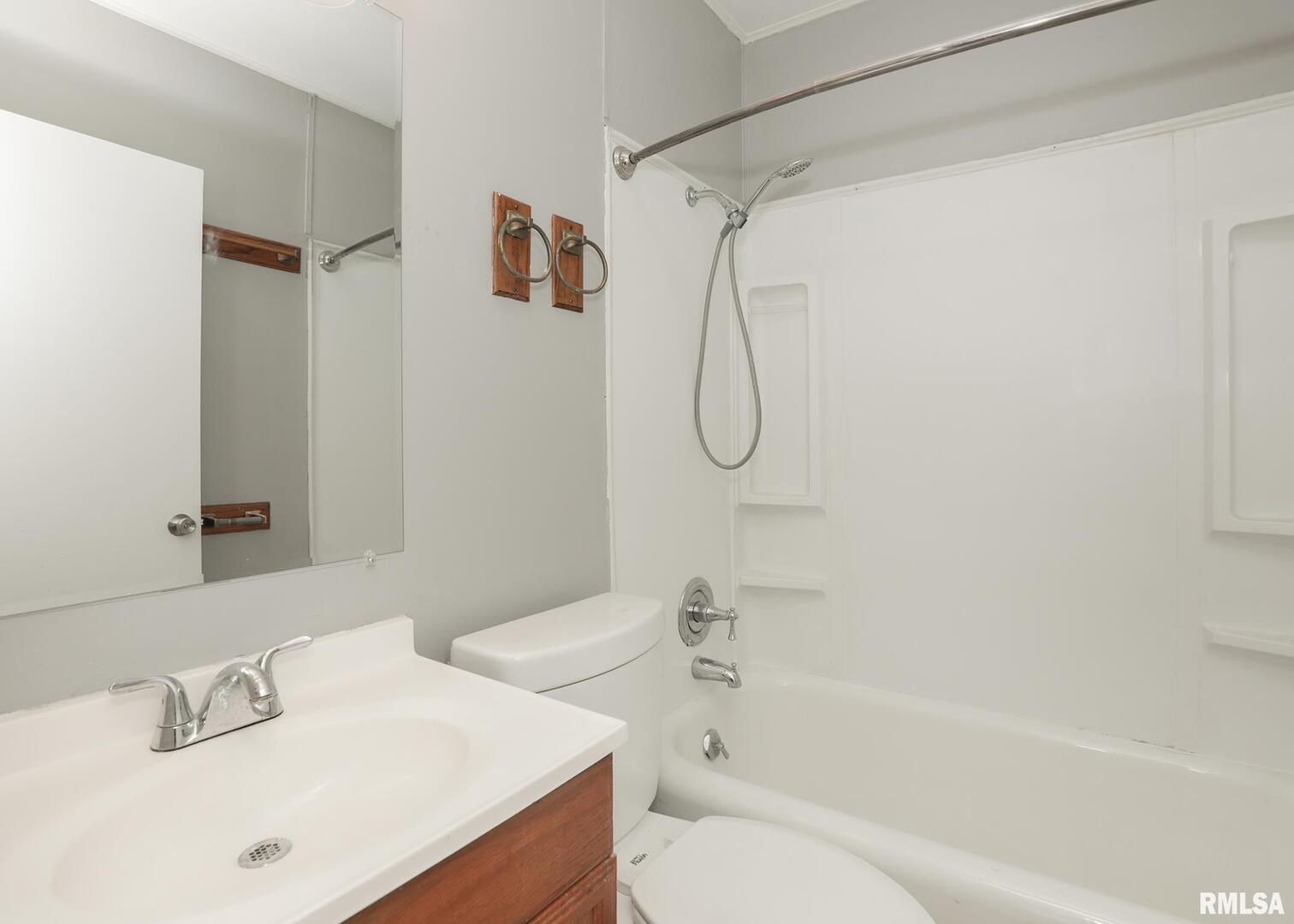934 20th Avenue Rock Island, IL 61201 - Photo 14 of 26 a bathroom with a sink a toilet and a bathtub