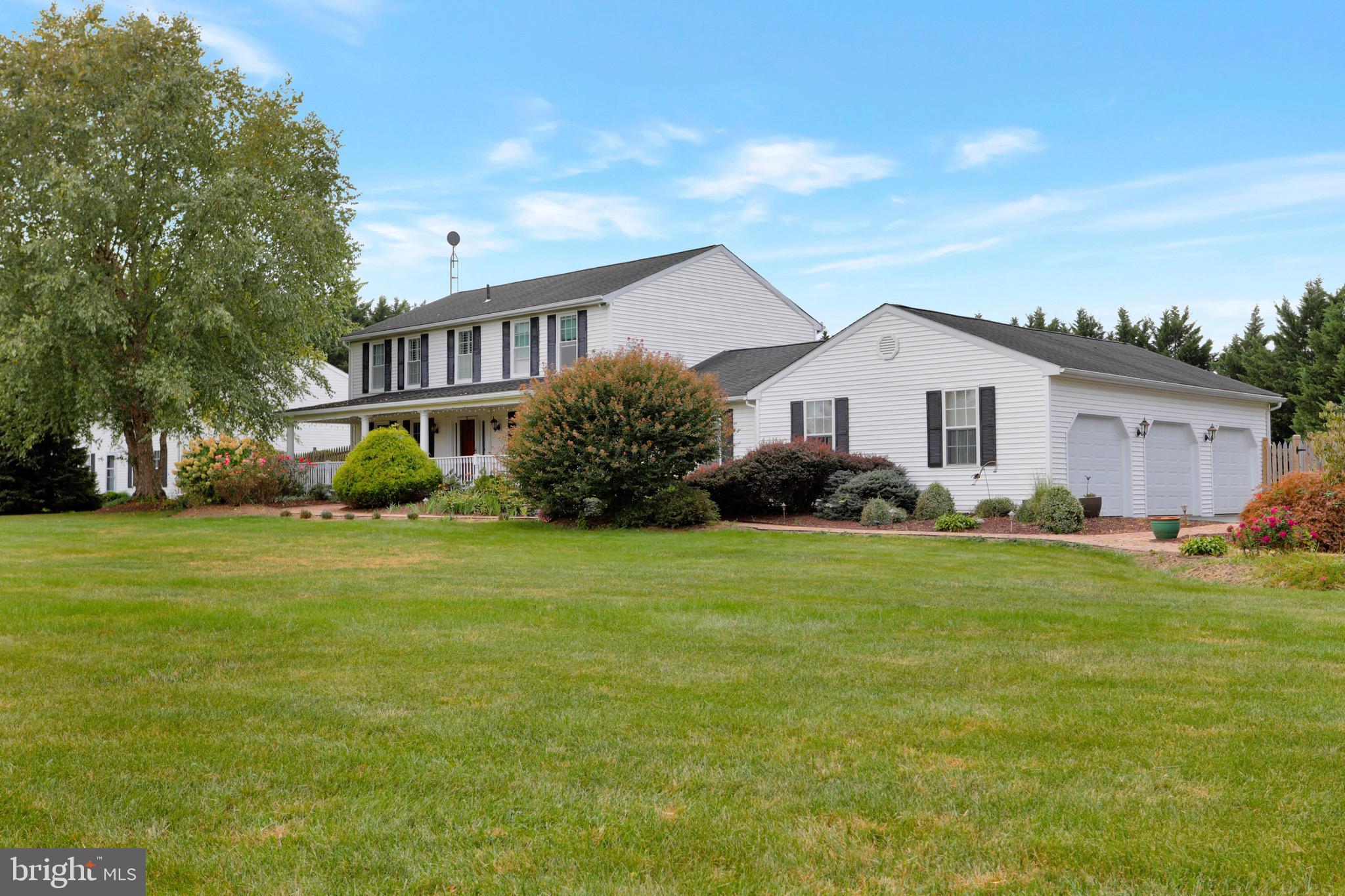 Traditional Colonial with 3 car attached garage