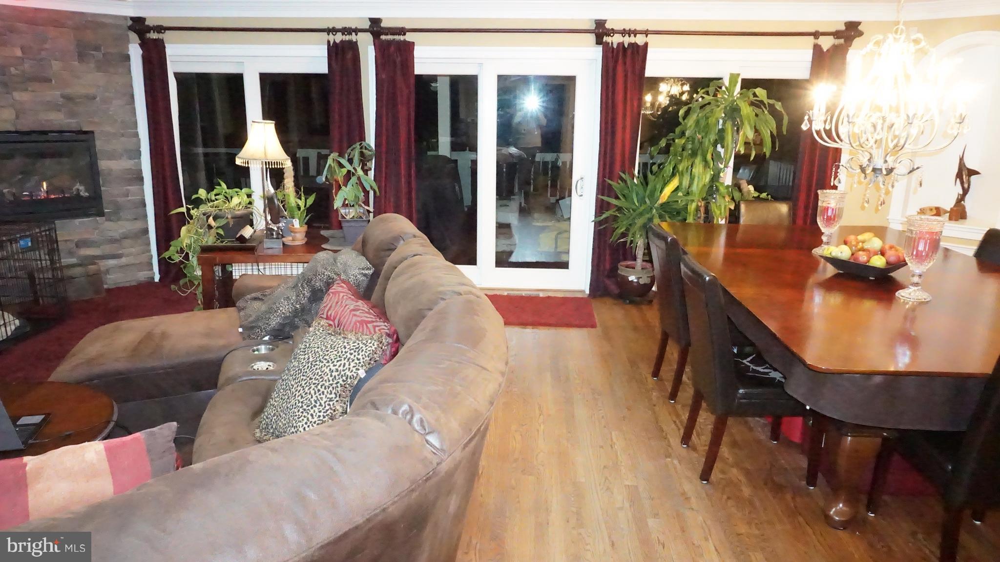 9105 Cuckold Point Road Baltimore, MD 21219 - Photo 150 of 150 a living room with furniture and a potted plant