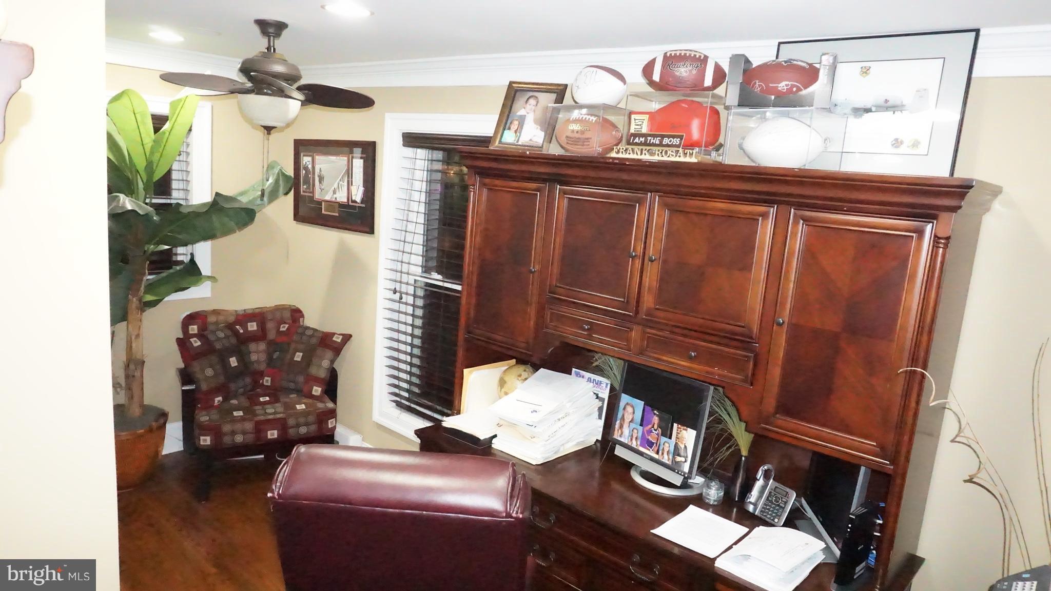 9105 Cuckold Point Road Baltimore, MD 21219 - Photo 146 of 150 a living room with furniture and wooden floor