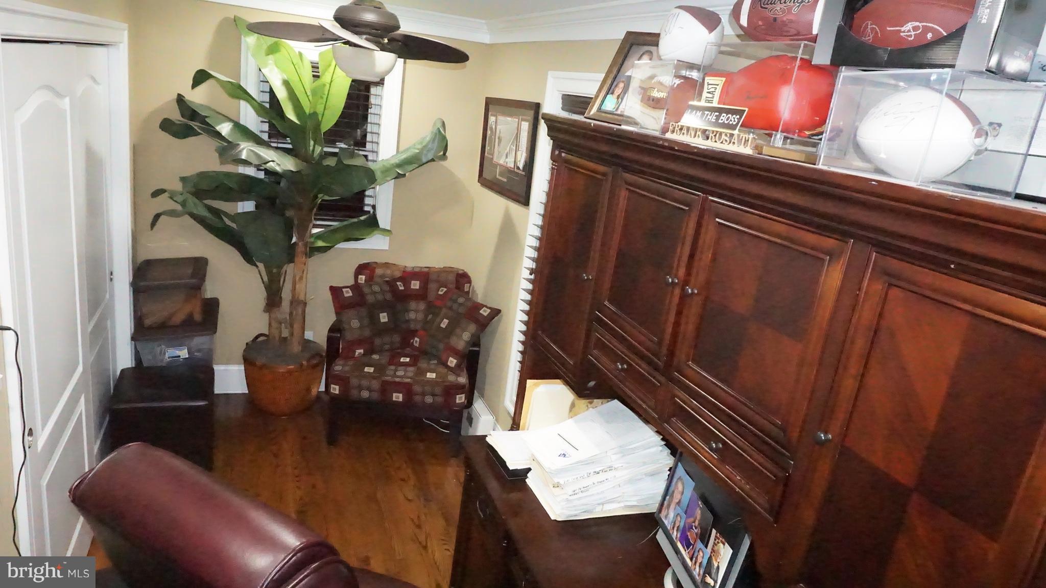 9105 Cuckold Point Road Baltimore, MD 21219 - Photo 28 of 150 a view of living room with furniture and a potted plant