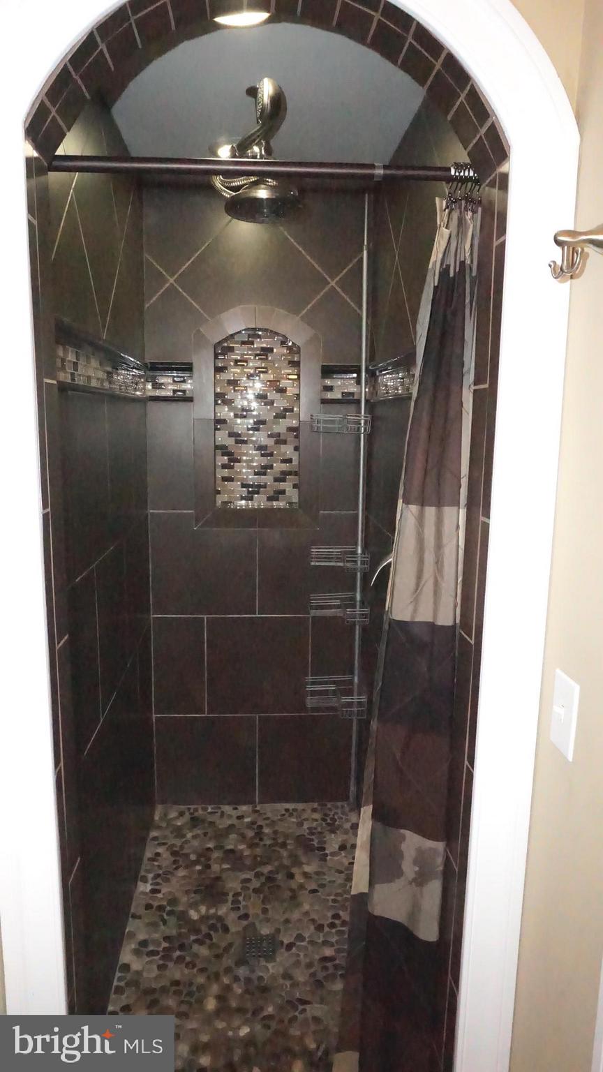 9105 Cuckold Point Road Baltimore, MD 21219 - Photo 34 of 150 Upper level Full Bath with river rock and granite