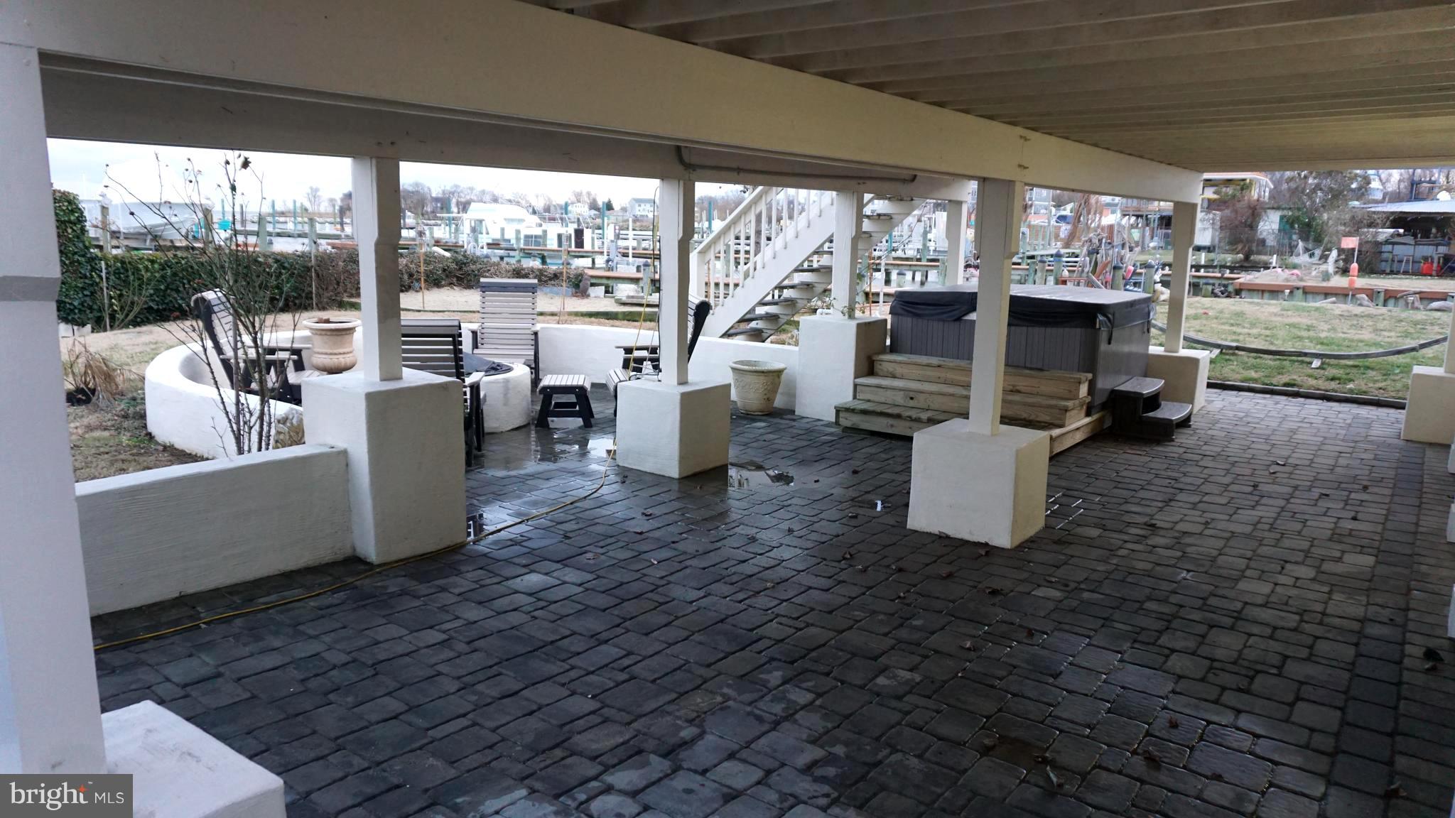 9105 Cuckold Point Road Baltimore, MD 21219 - Photo 54 of 150 33x30 custom pavered patio w/firepit and hot tub